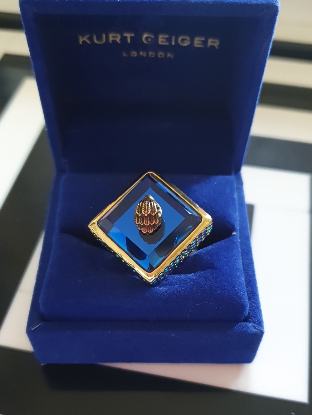 Kurt Geiger Gold-Tone Ring with Deep Blue Faceted Stone